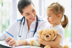 doctor examining a child in a hospital